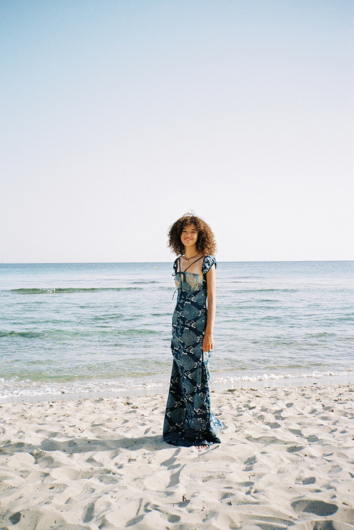 Scan 06 — navy maxi dress on open beach