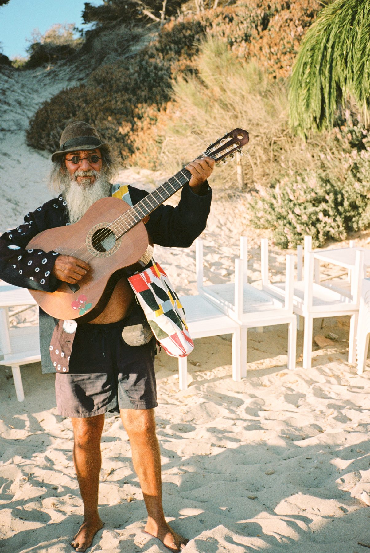 Scan 24 — shibori dreamscape shirt and patchwork tote, guitar in the dunes
