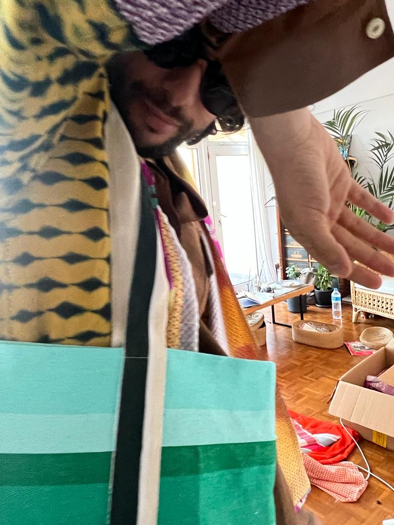 In the atelier — layered SS26 knits and the teal colorblock Mambo tote